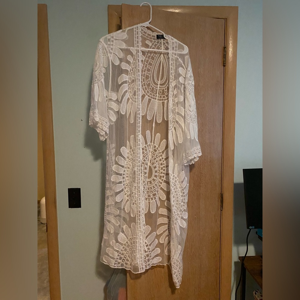 Can be worn as a kimono or swim suit cover up! One size fits all.